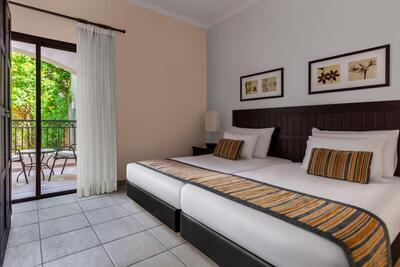 Jaz Makadi Saraya Palms - Three-Bedroom Suite, Queen And Twin Bed– Garden View 